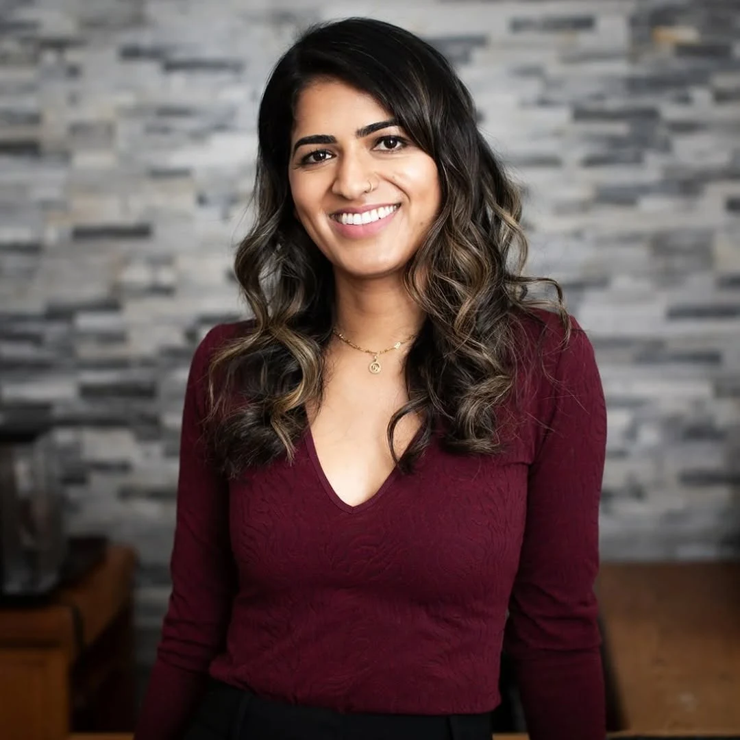 A smiling woman in the High Park Smile Studio office