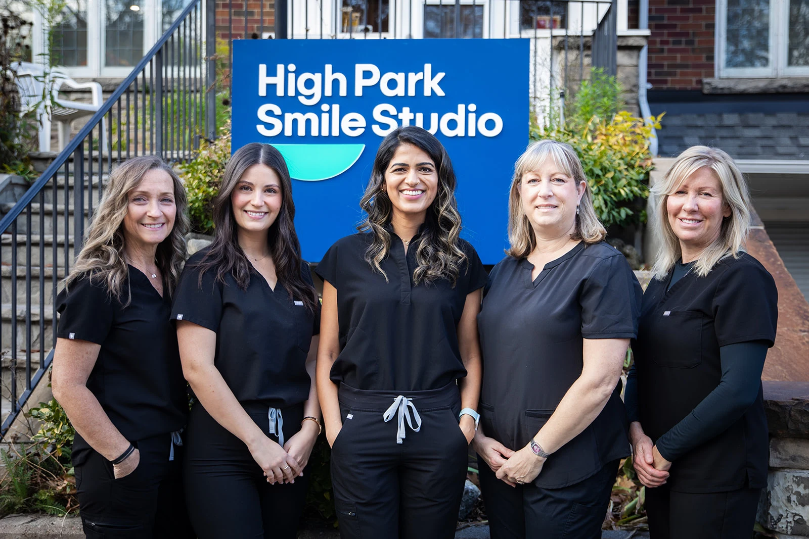 The High Park Smile Studio team standing outside the office