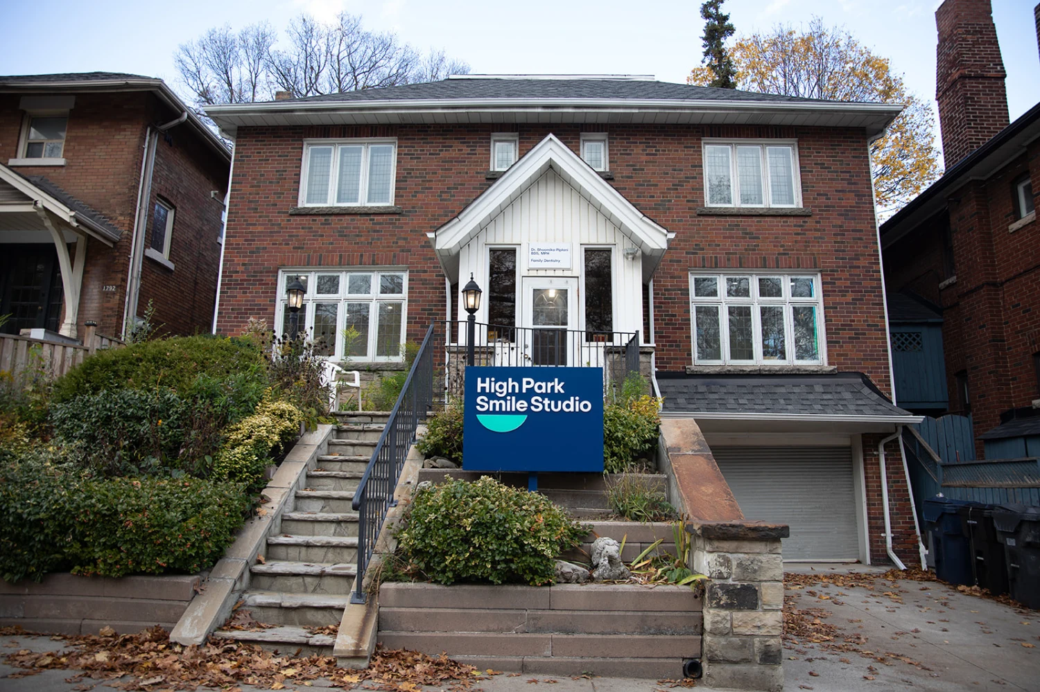 The brick exterior and front steps of High Park Smile Studio