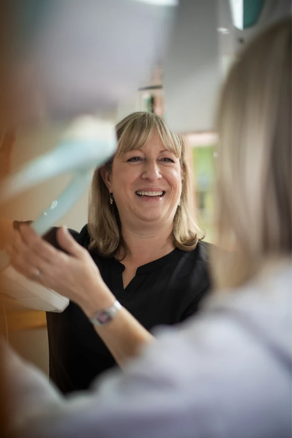 A team member reviewing dental X-rays at High Park Smile Studio